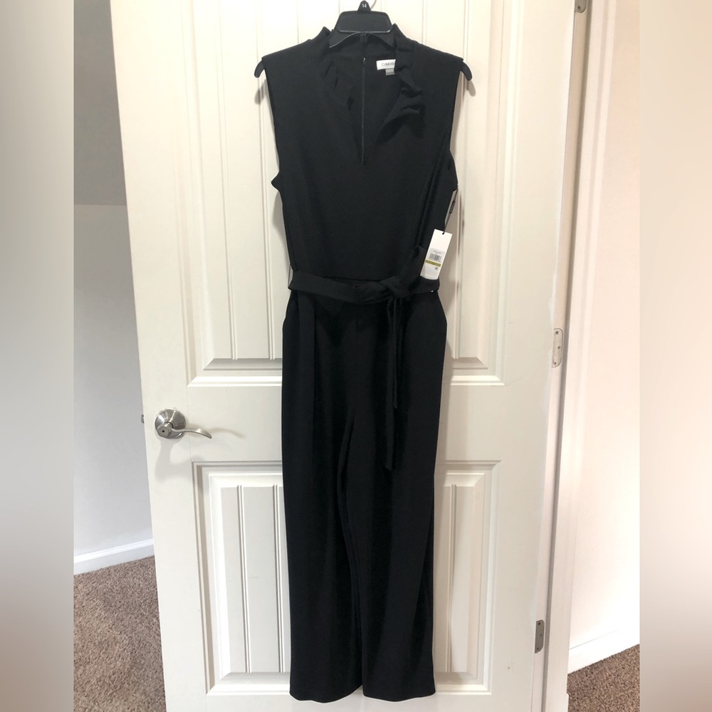 Adorable black jumpsuit w/ ruffle collar detail